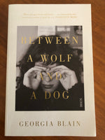 Blain, Georgia - Between a Wolf and a Dog (Trade Paperback)